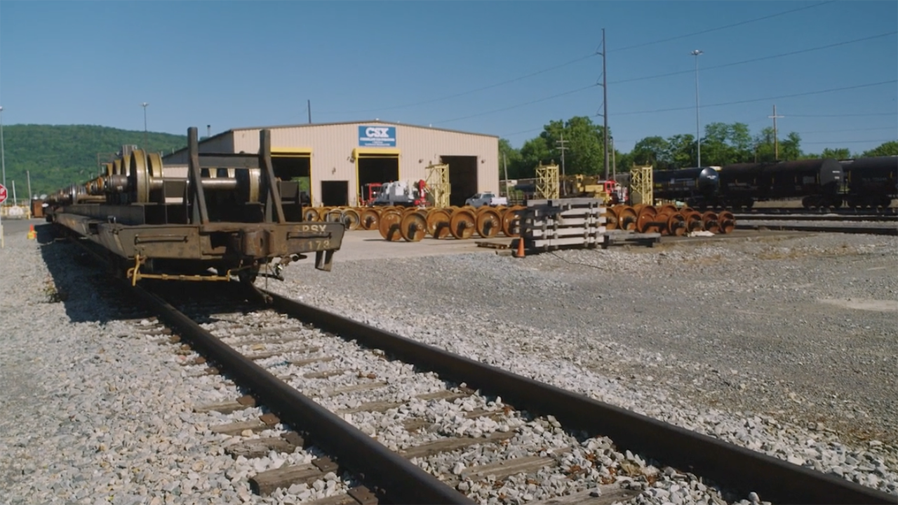 Changes at the Cumberland, Md., rail yard (pictured) will enable the CSX team to assemble trains on two automated tracks while simultaneously moving other cars, “effectively reducing car handlings, doubling their production capacity and ensuring faster and more reliable delivery of customer goods,” according to the railroad. (Screenshot of CSX Video)