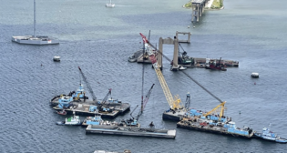 Aerial photos taken Friday afternoon, June 7, 2024 by Maryland State Police Aviation Command shows salvors continue pulling massive, mangled chunks of Francis Scott Key Bridge wreckage from the depths of the Patapsco River.
